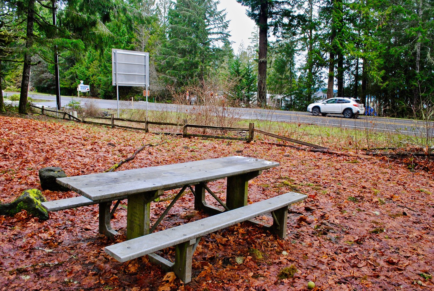 Picnic table near busy state highway provides sanctuary for the weary driver. However, this table, though blessedly near, is only attained when camping overnight and paying a state park camping fee.